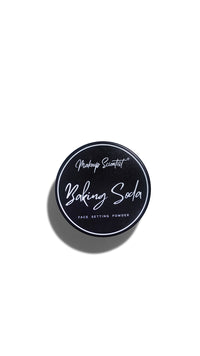 Baking soda face setting powder container on a white background