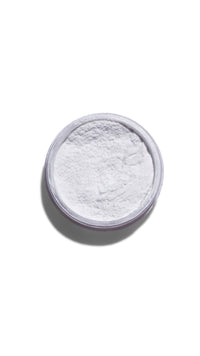 White powder in a round container on a white background