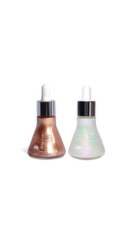 Two iridescent skincare bottles with droppers on a white background
